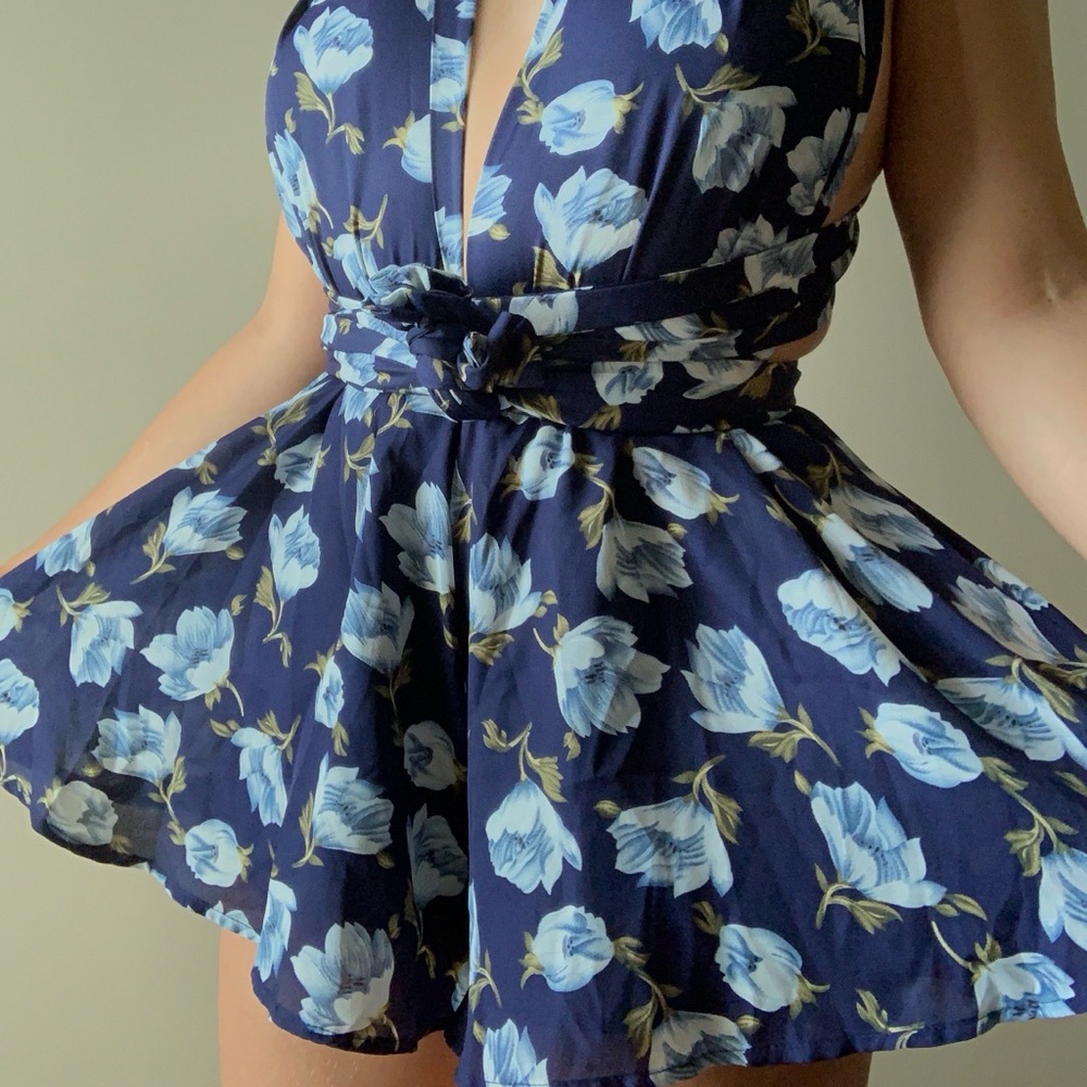 This beautiful romper dark blue with flowers.